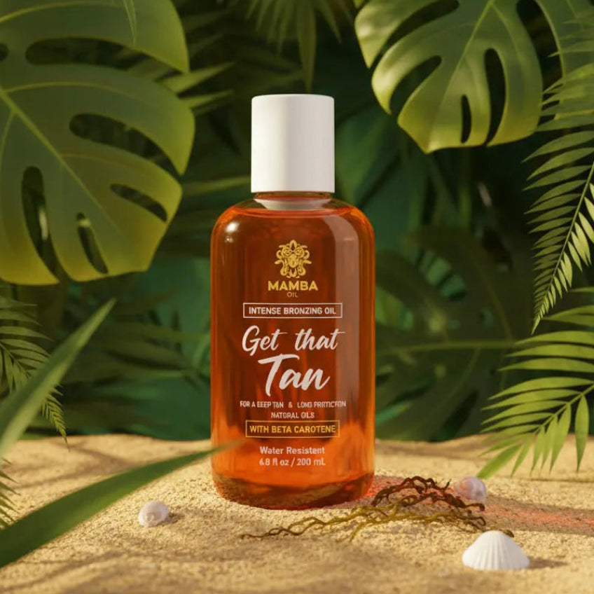 Bottle of Mamba tanning oil with tropical leaves in the background