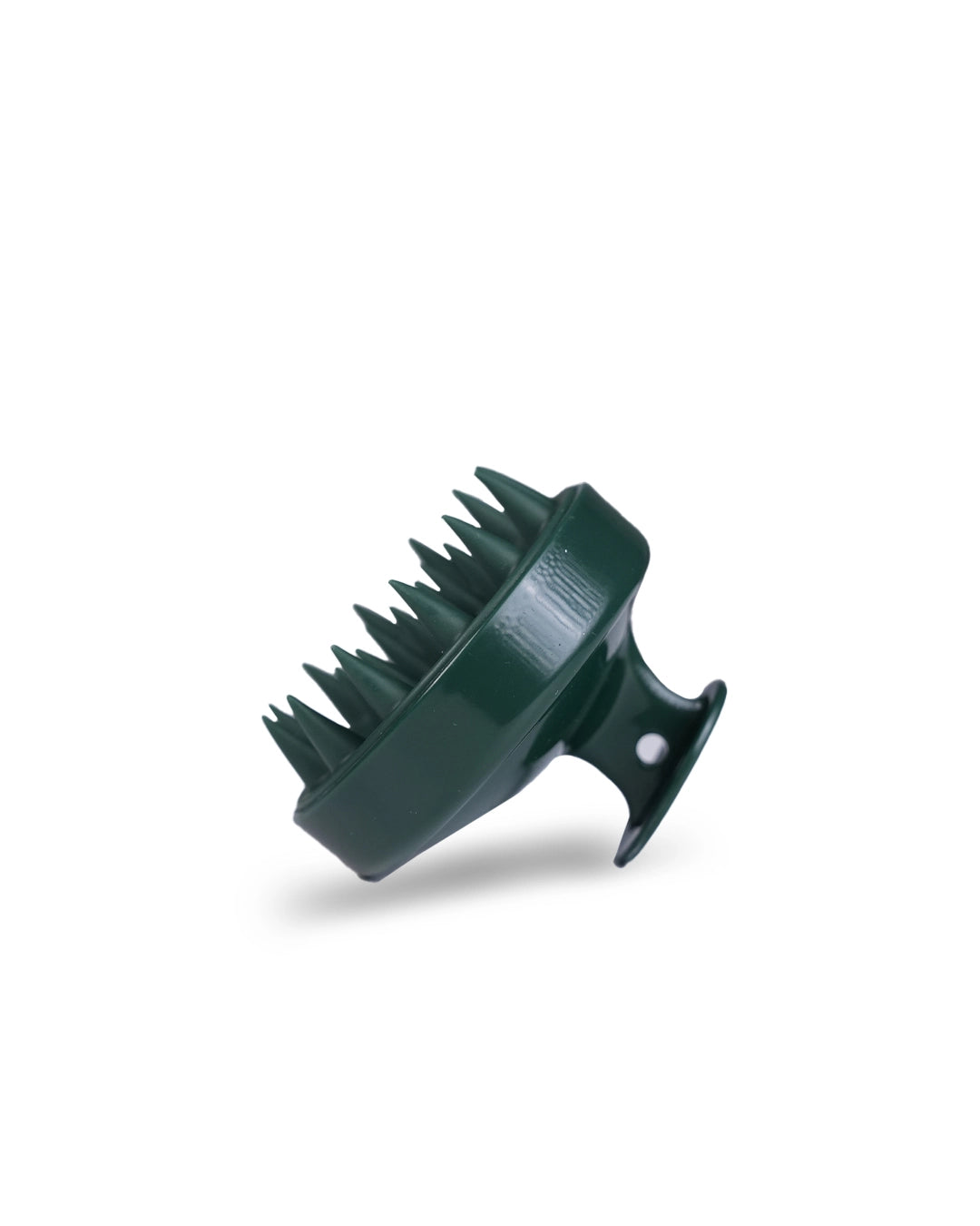 Green plastic brush on a white background